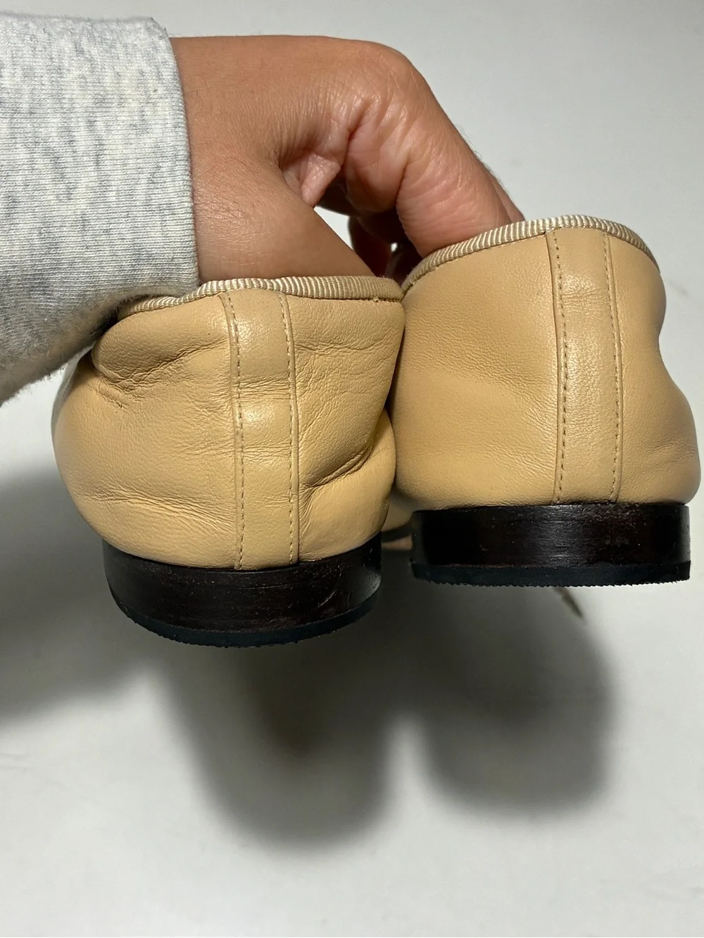 CHANEL Beige Leather Ballet Flats with Black Cap Toe and CC Logo